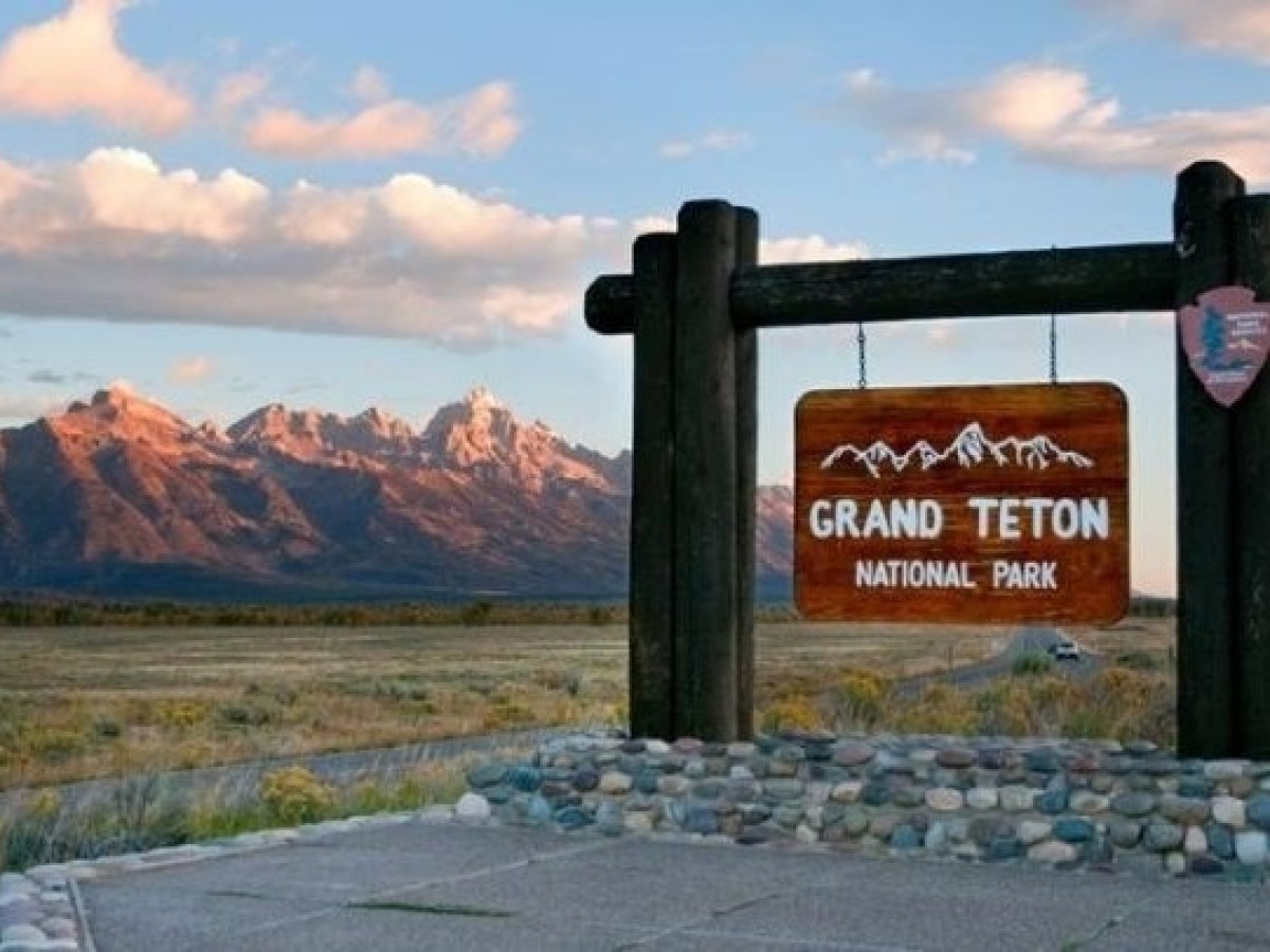 a sign on the side of a mountain
