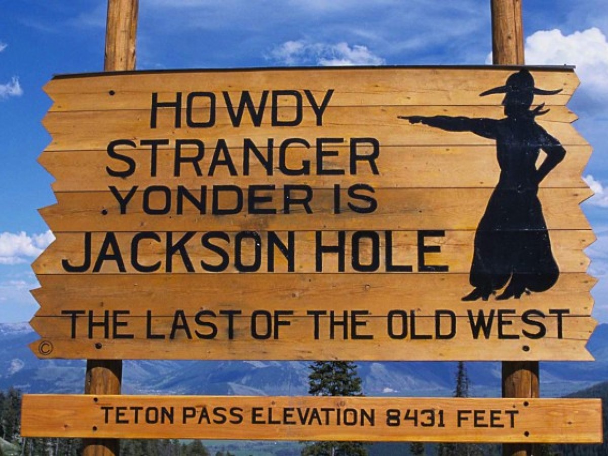 a sign on a wooden pole