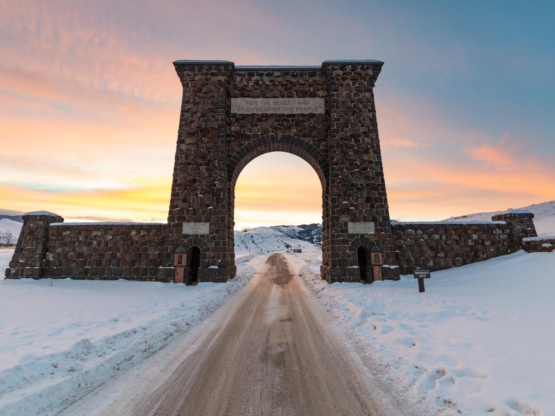 a snow covered bridge with George Washington Bridge in the background