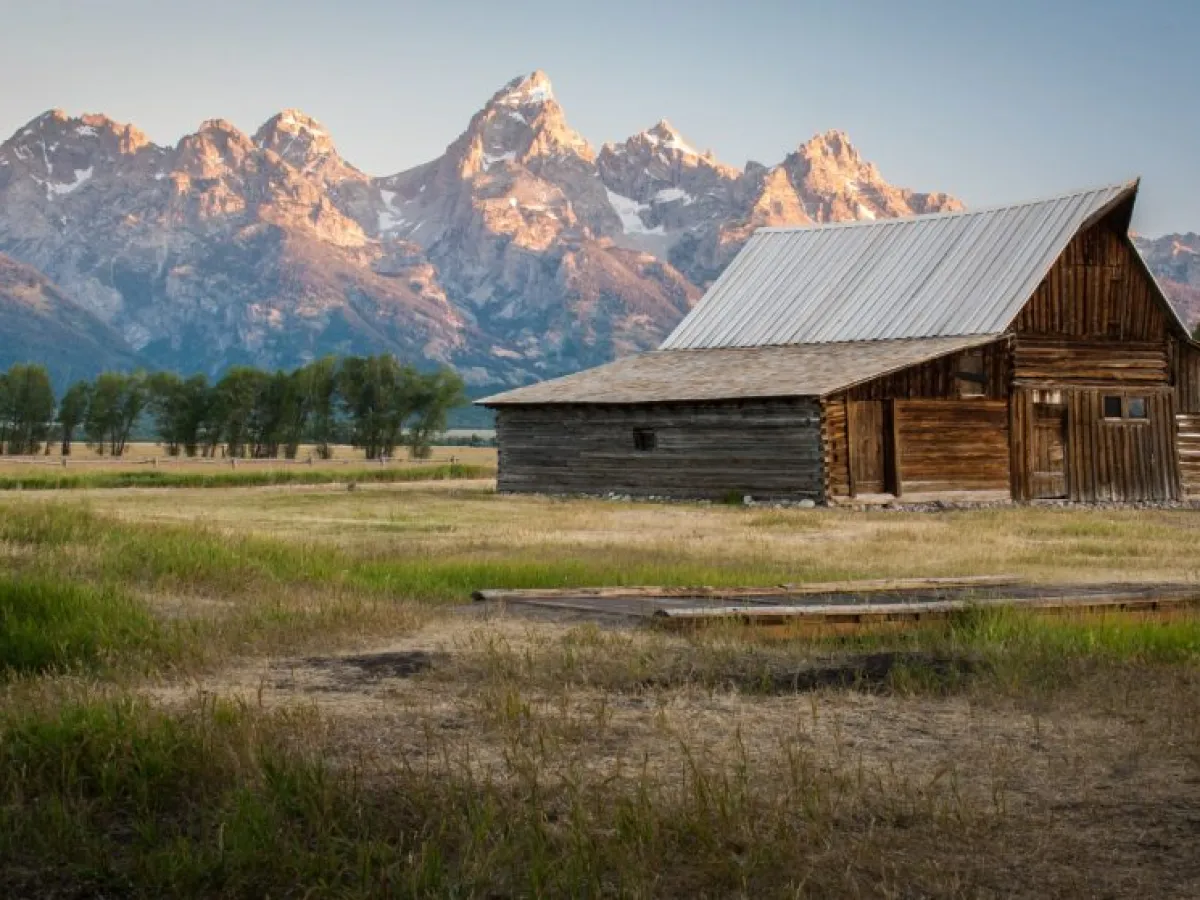 a house with a mountain in the background