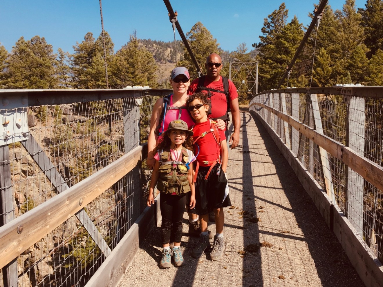 a group of people standing on a bridge