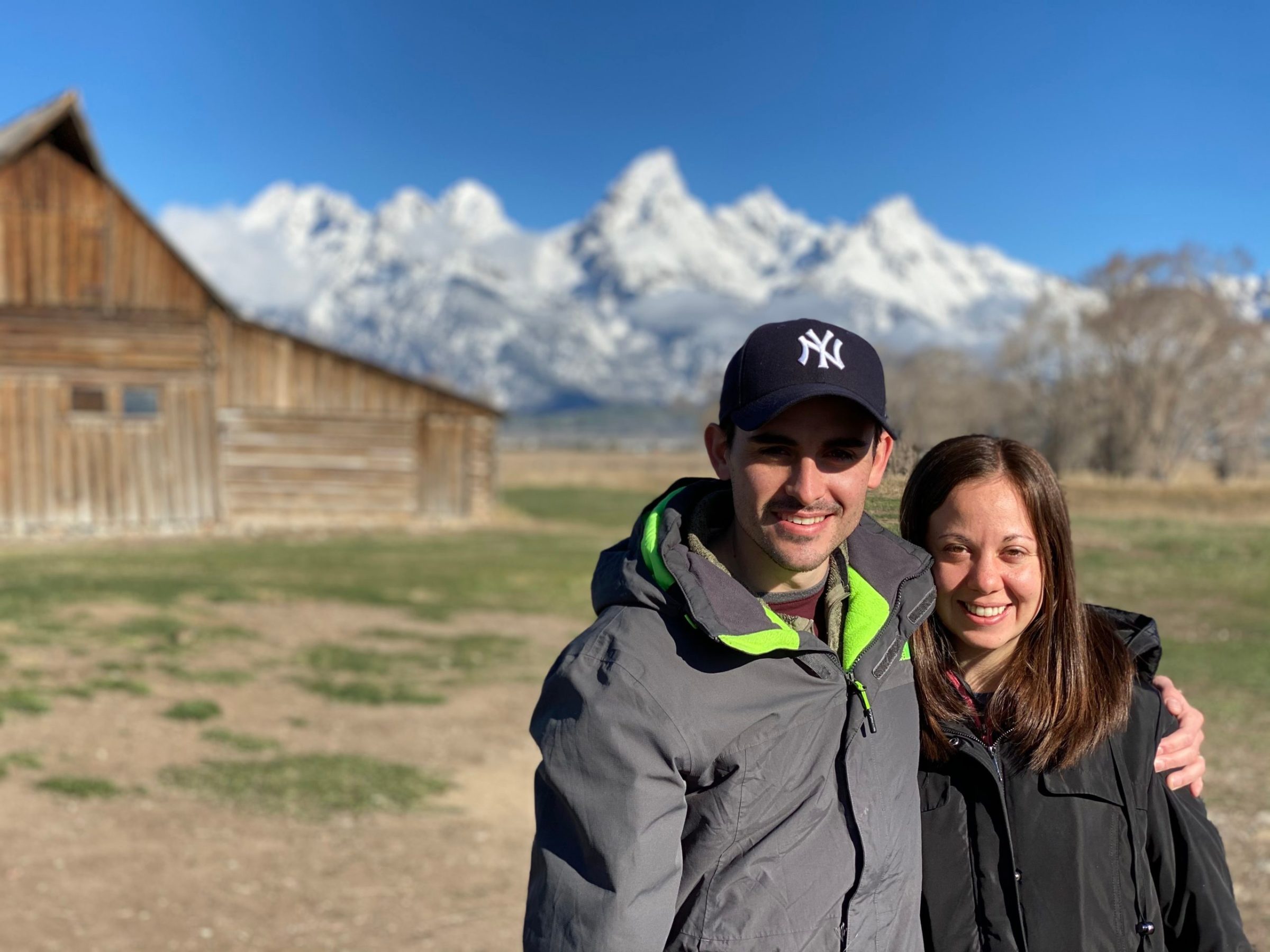 Couple at Moulton Barn in front of Tetons