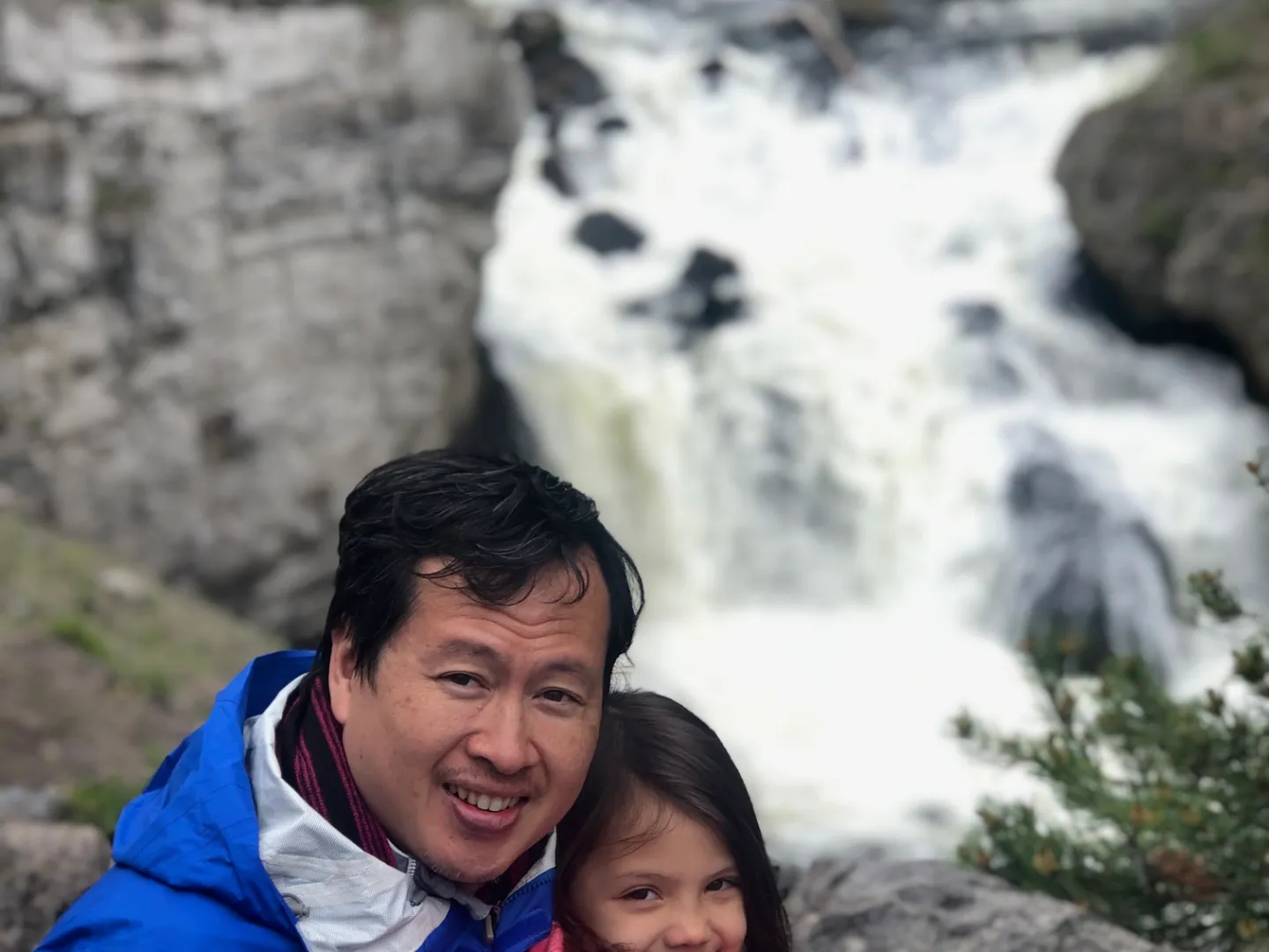 a little boy that is standing in the snow