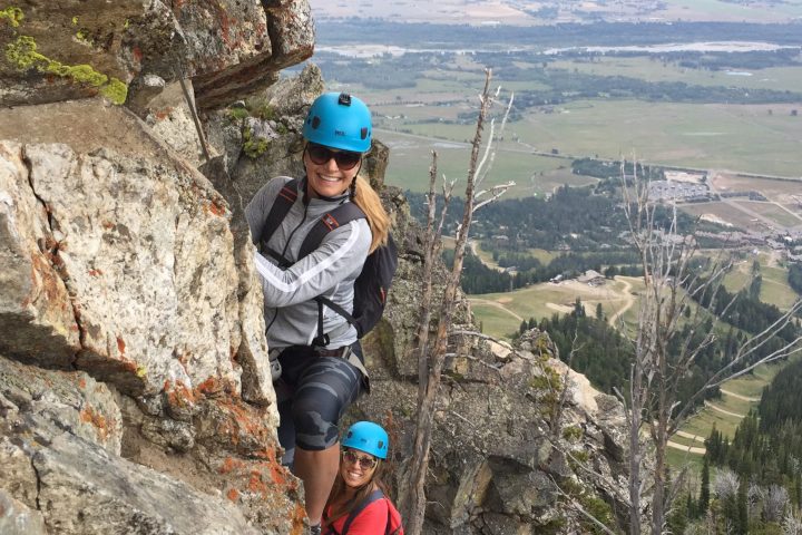 a man standing on a rocky hill