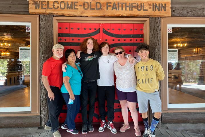 Andrew Cottrill et al. standing in front of a building