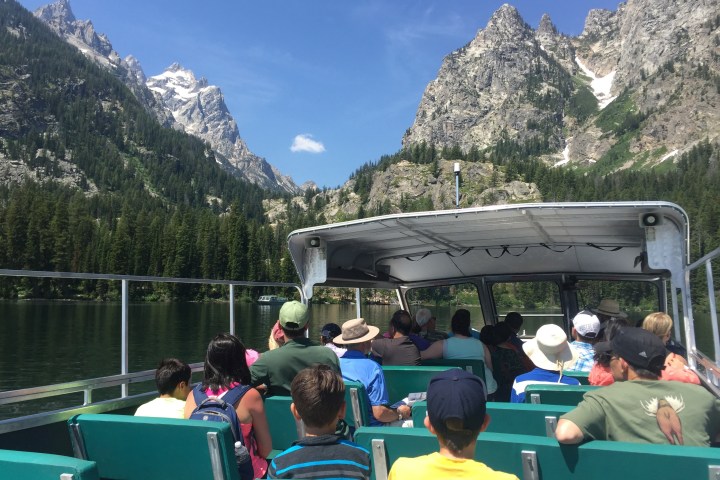 a group of people standing on top of a mountain