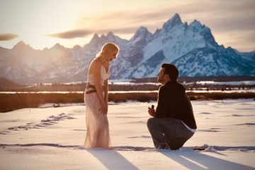 a couple of people that are standing in the snow