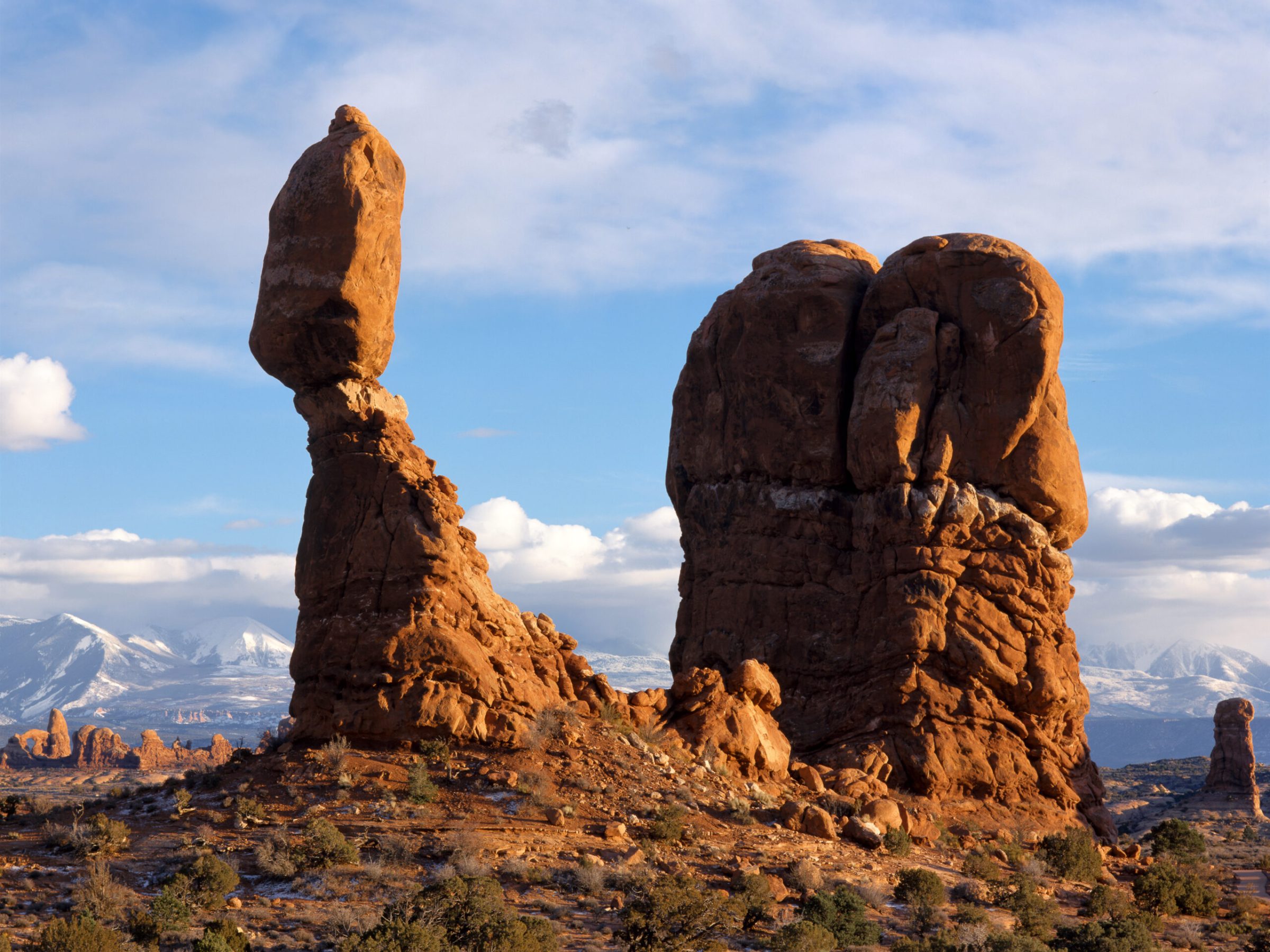 a canyon with Arches National Park in the background