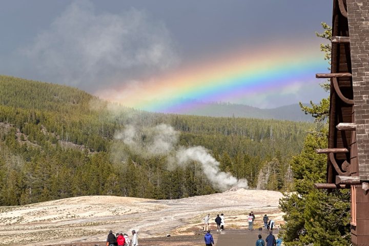 a group of people walking down a dirt road