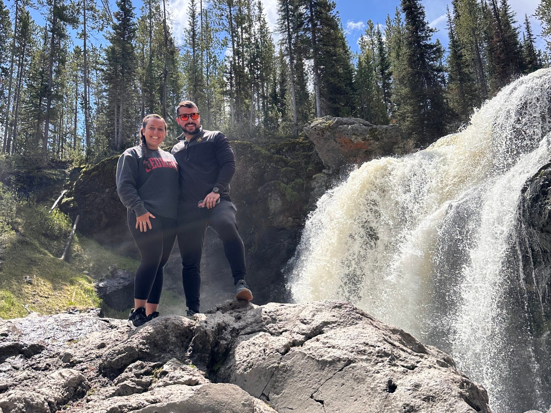 a group of people on a rock