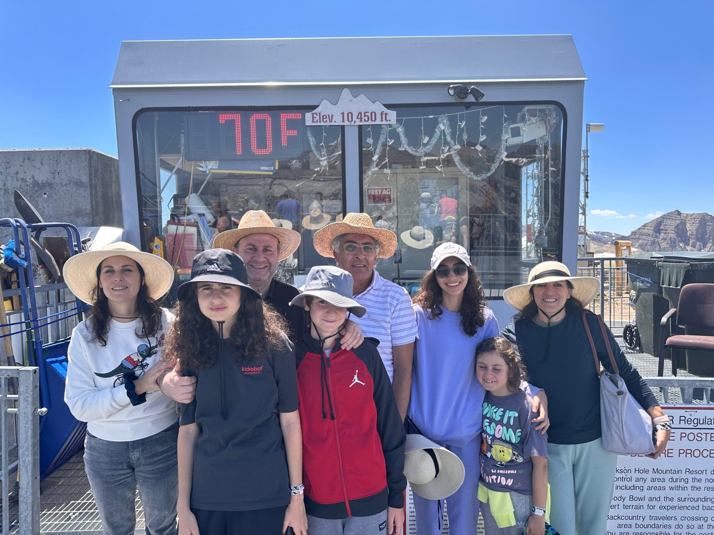 a group of people standing in front of a crowd posing for the camera