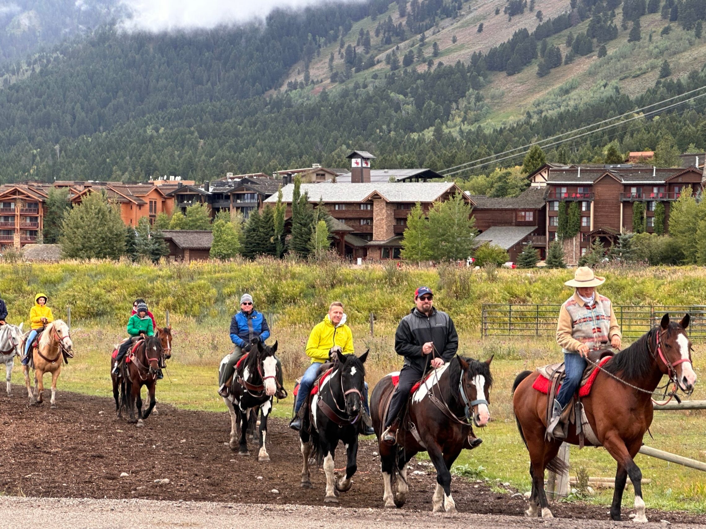 a group of people riding on the back of a horse