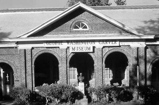 Historic brick building labeled George Washington Carver Museum.